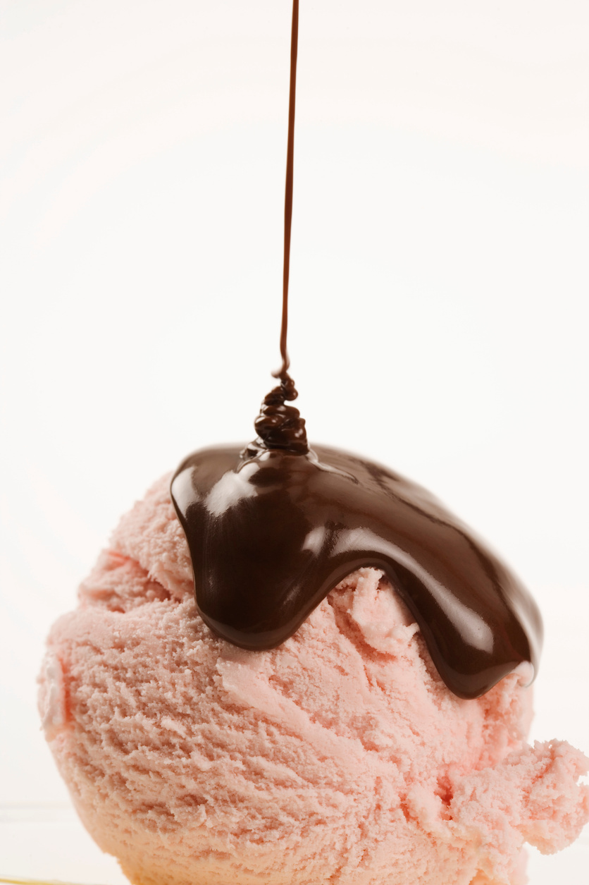 Ice cream drizzled with chocolate syrup