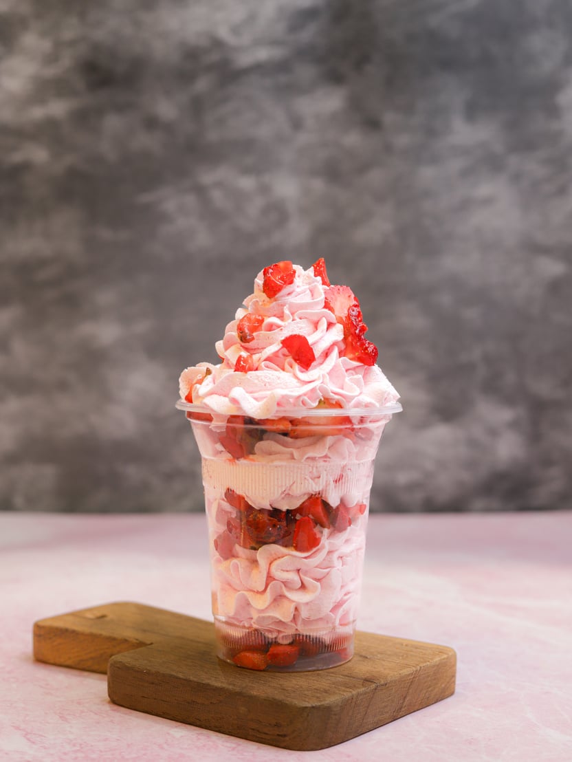 Glass filled with strawberry ice cream